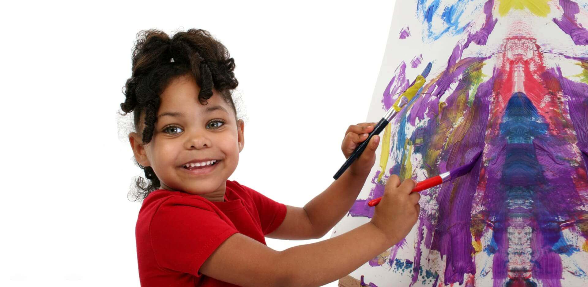 toddler painting on a canvass